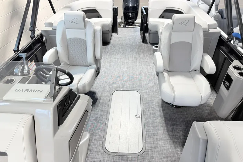Slide: The Image of 2026 Qwest L-Class 20 RLS boat interior with plush seating and Garmin navigation system. - 12