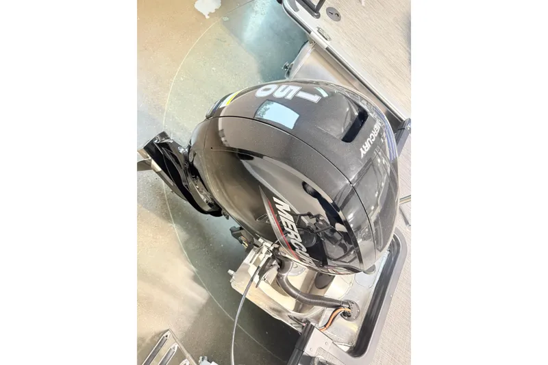 Slide: The Image of Outboard motor on a 2026 Qwest L-Class 20 RLS boat, featuring Mercury branding. - 17