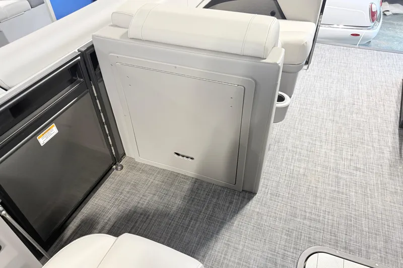 Slide: The Image of Interior of 2026 Qwest L-Class 20 RLS boat, featuring seating and storage. - 18