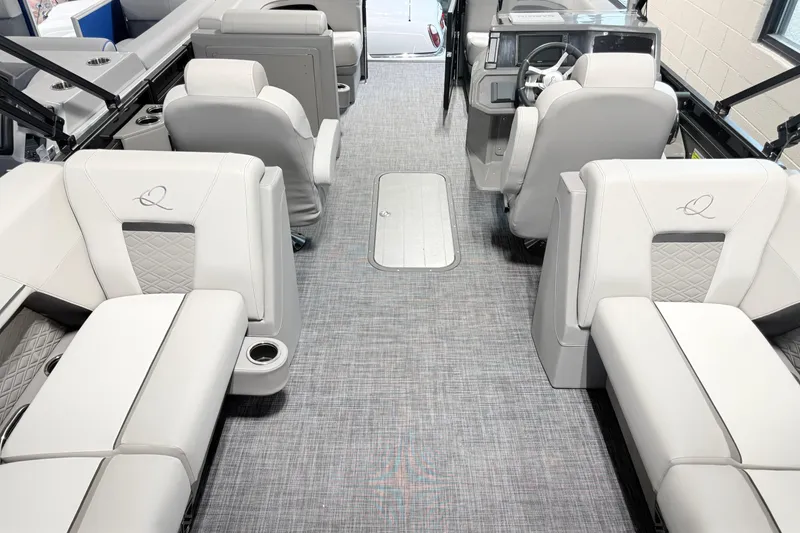 Slide: The Image of Luxurious interior of 2026 Qwest L-Class 20 RLS pontoon boat with plush seating. - 2