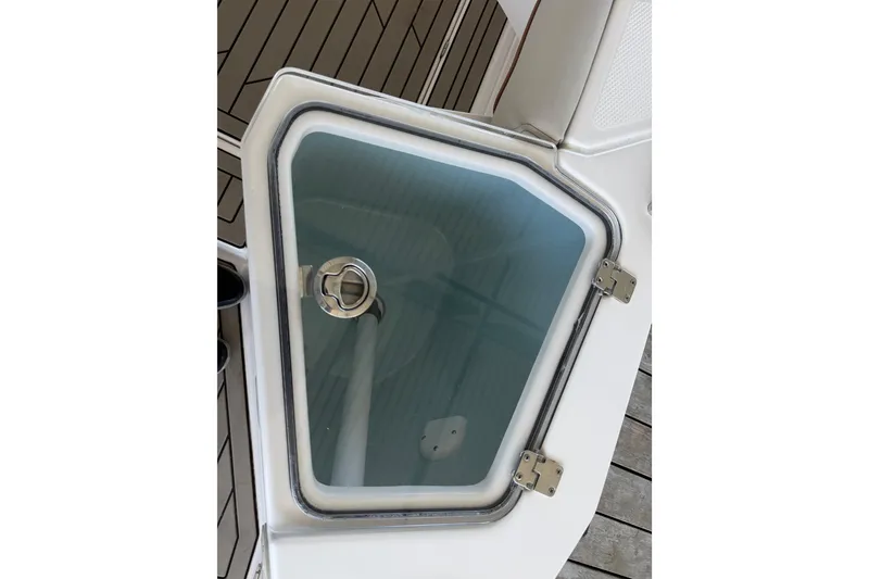 Slide: The Image of 2023 Cutwater C-288 Coupe boat hatch with secure latch and sleek design. - 15