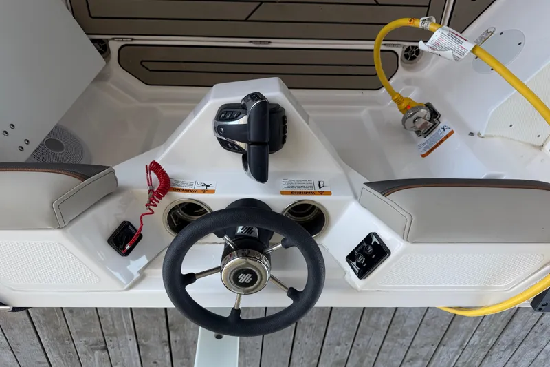 Slide: The Image of Helm of 2023 Cutwater C-288 Coupe with steering wheel and controls. - 16