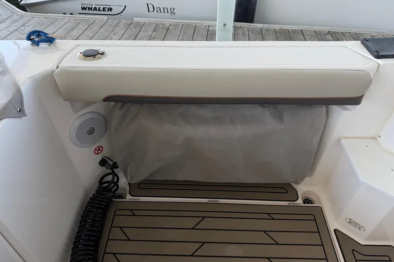 Slide: The Image of 2023 Cutwater C-288 Coupe boat interior with cushioned seating and speaker system. - 20