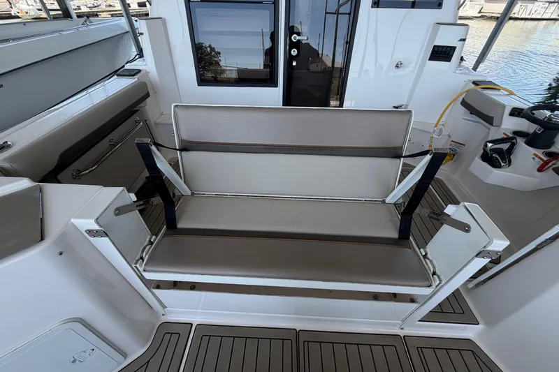 Slide: The Image of 2023 Cutwater C-288 Coupe interior with foldable seating and modern design. - 23