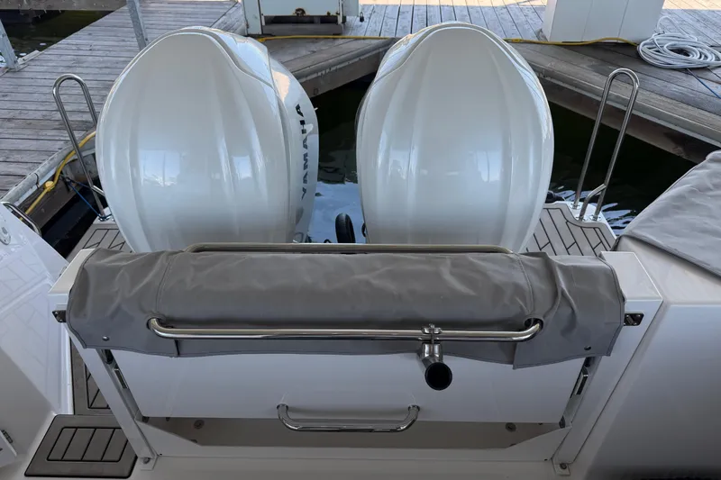 Slide: The Image of 2023 Cutwater C-288 Coupe boat with dual Yamaha outboard engines at dock. - 26