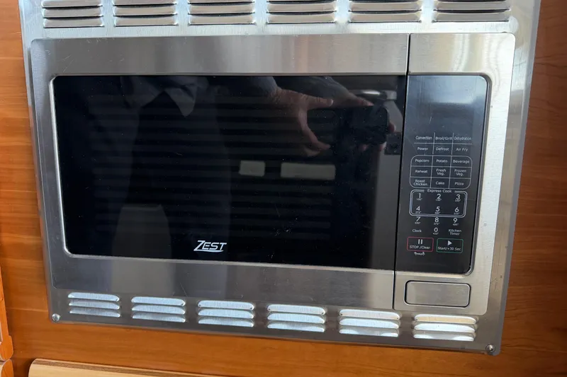 Slide: The Image of Built-in Zest microwave in 2023 Cutwater C-288 Coupe boat kitchen. - 30