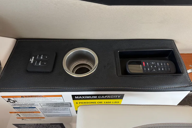 Slide: The Image of 2023 Cutwater C-288 Coupe console with controls, cup holder, and remote storage. - 36