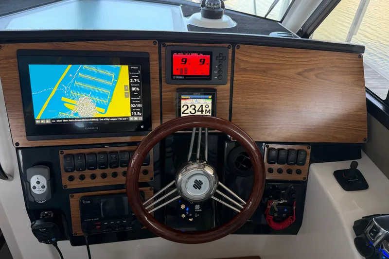 Slide: The Image of 2023 Cutwater C-288 Coupe dashboard with navigation and control systems. - 37