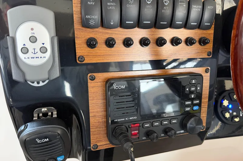 Slide: The Image of Control panel of a 2023 Cutwater C-288 Coupe boat with Icom marine radio. - 38