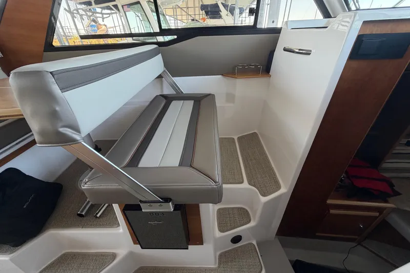 Slide: The Image of Interior seating of 2023 Cutwater C-288 Coupe boat, featuring modern design and comfortable upholstery. - 41