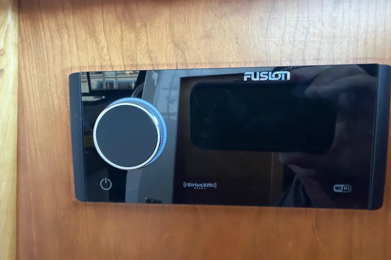 Slide: The Image of Fusion audio system in 2023 Cutwater C-288 Coupe boat, featuring SiriusXM and WiFi connectivity. - 50