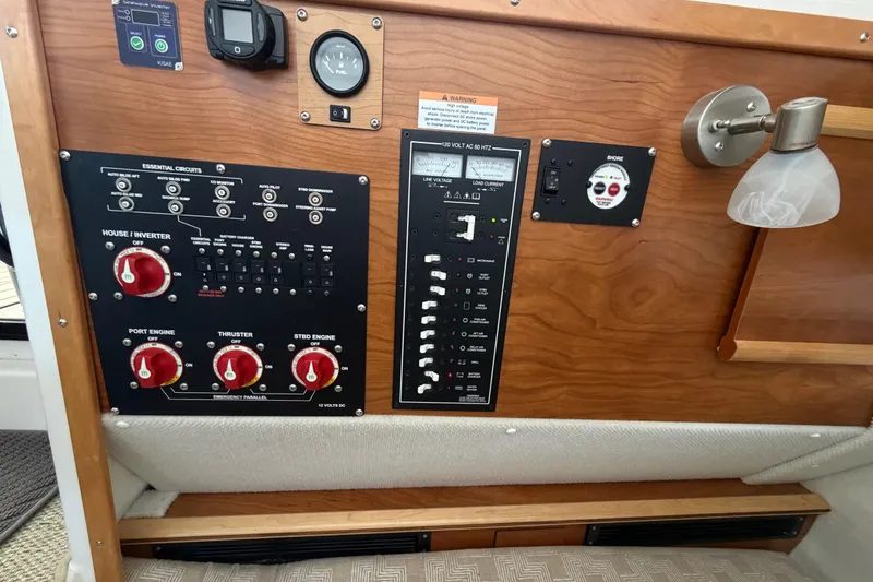 Slide: The Image of Control panel of 2023 Cutwater C-288 Coupe boat with switches and gauges. - 53