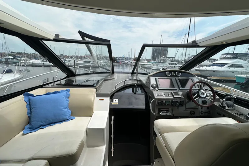 Slide: The Image of Interior view of 2012 Regal 42 Sport Coupe yacht at marina. - 17