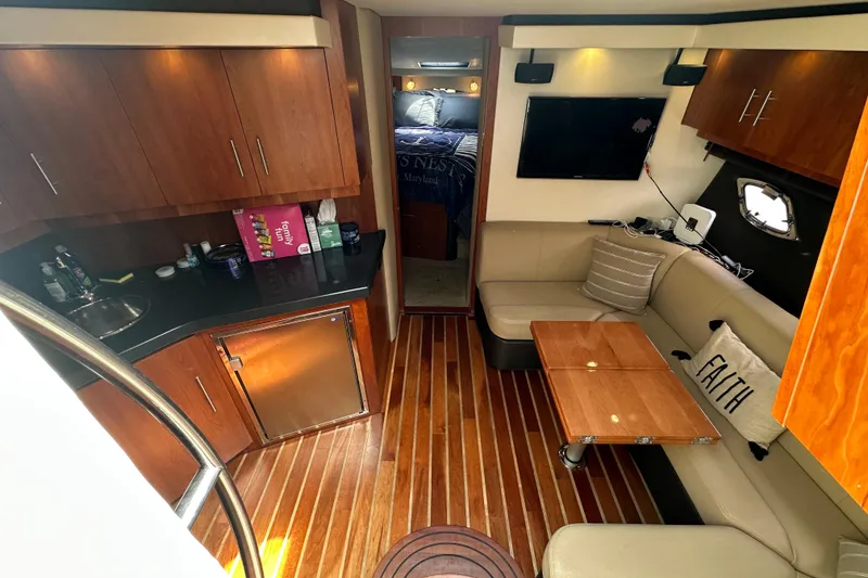 Slide: The Image of Luxurious interior of 2012 Regal 42 Sport Coupe with wood flooring and modern amenities. - 23