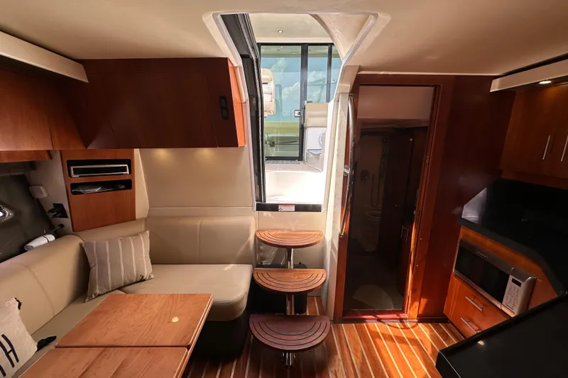 Slide: The Image of Interior of 2012 Regal 42 Sport Coupe yacht with modern kitchen and seating area. - 30