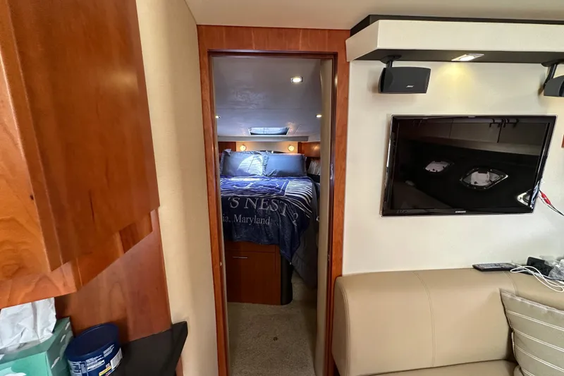 Slide: The Image of Interior of 2012 Regal 42 Sport Coupe with cozy bedroom and wall-mounted TV. - 31