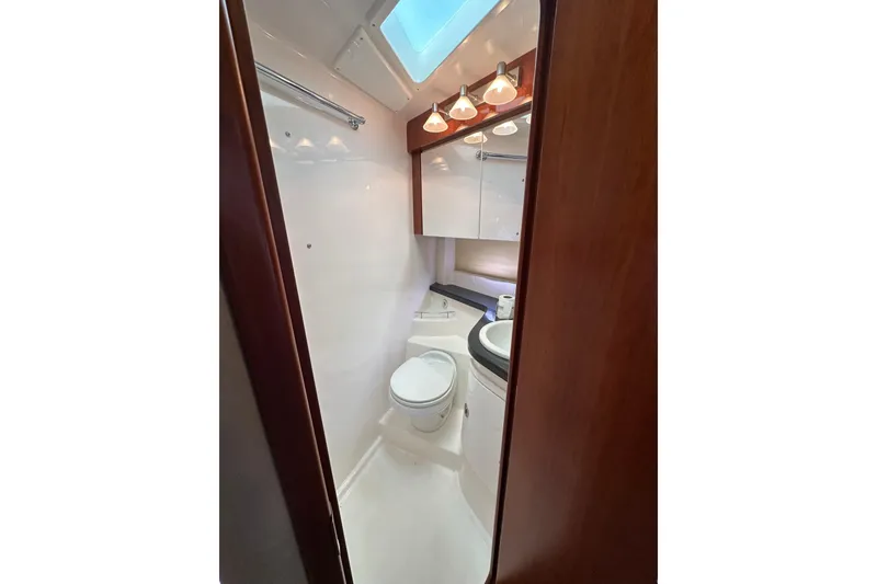 Slide: The Image of Luxurious bathroom in 2012 Regal 42 Sport Coupe yacht with modern fixtures. - 36