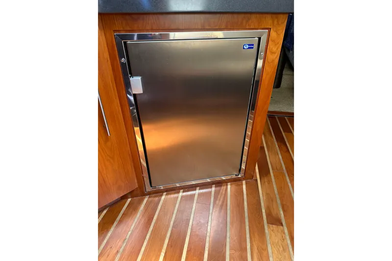 Slide: The Image of Stainless steel cabinet door on 2012 Regal 42 Sport Coupe yacht interior. - 39