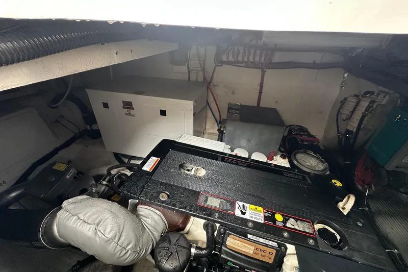 Slide: The Image of Engine room of a 2012 Regal 42 Sport Coupe with visible machinery and components. - 43