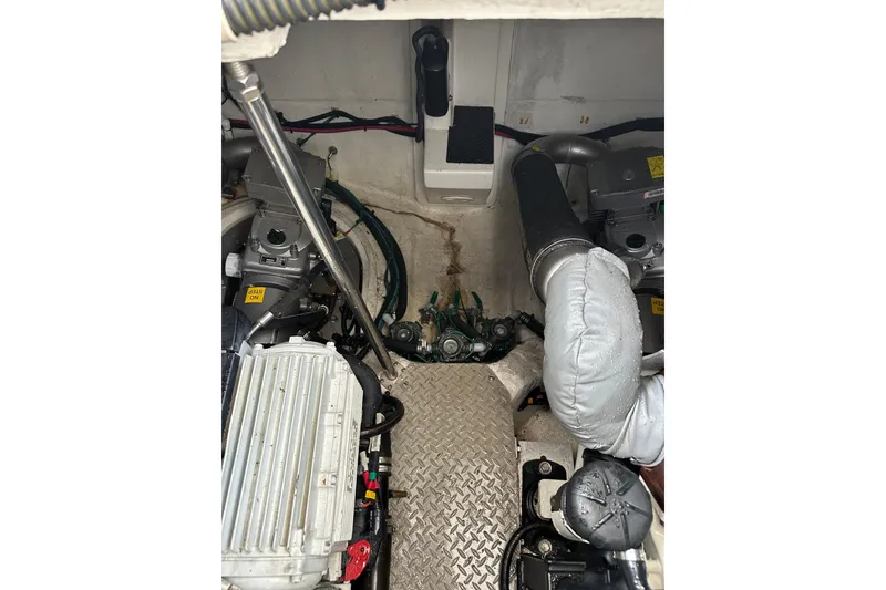 Slide: The Image of Engine room of a 2012 Regal 42 Sport Coupe with visible components and wiring. - 45