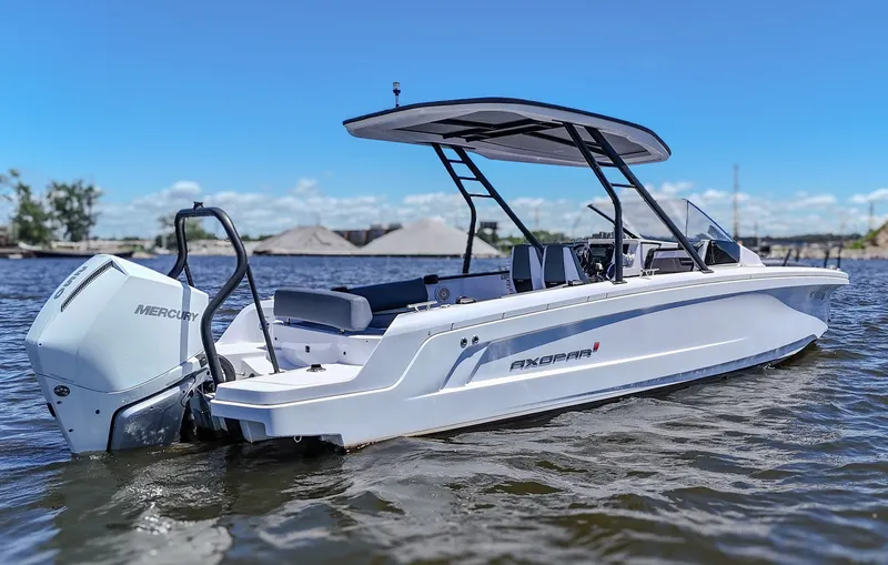 The Image of A white Axopar boat on the water with a Mercury engine. - 0
