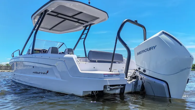 Slide: The Image of A modern motorboat with an open deck and a Mercury outboard engine on calm water. - 11