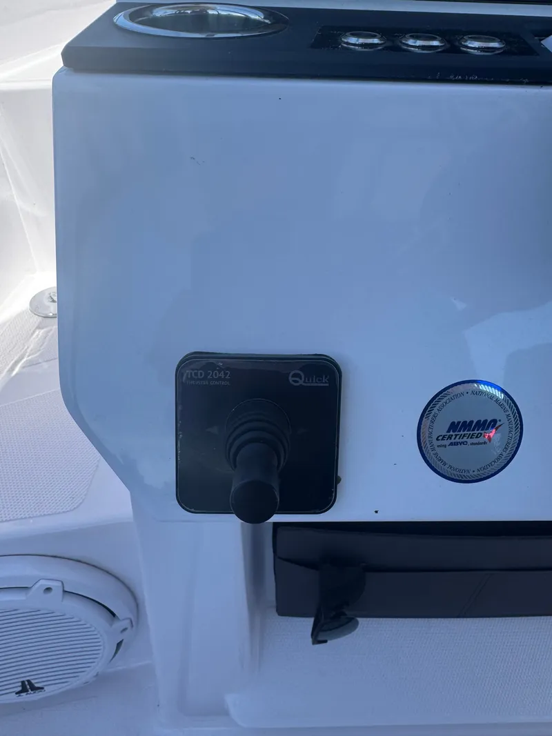 Slide: The Image of Close-up of a control panel with joystick and speaker. - 18