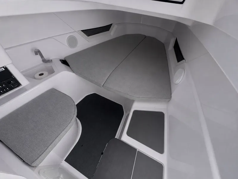 Slide: The Image of Interior of a modern boat cabin with gray cushions and minimalist details. - 23