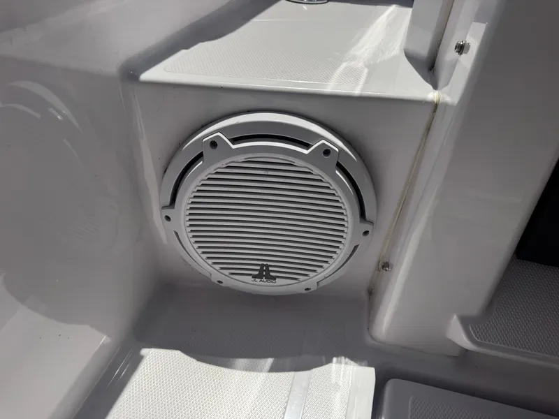Slide: The Image of A speaker is mounted in the white wall of a boat. - 26