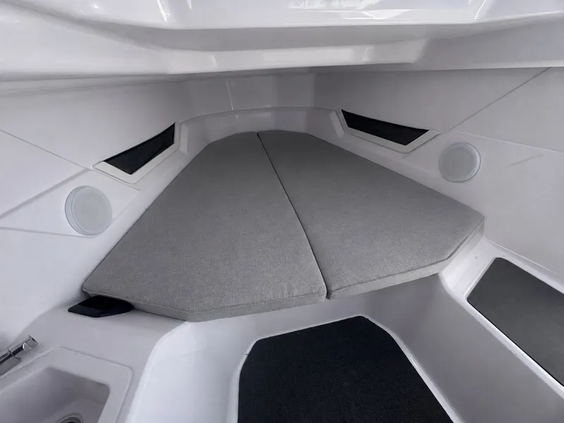 Slide: The Image of Interior of a modern boat cabin with gray cushions and white walls. - 4