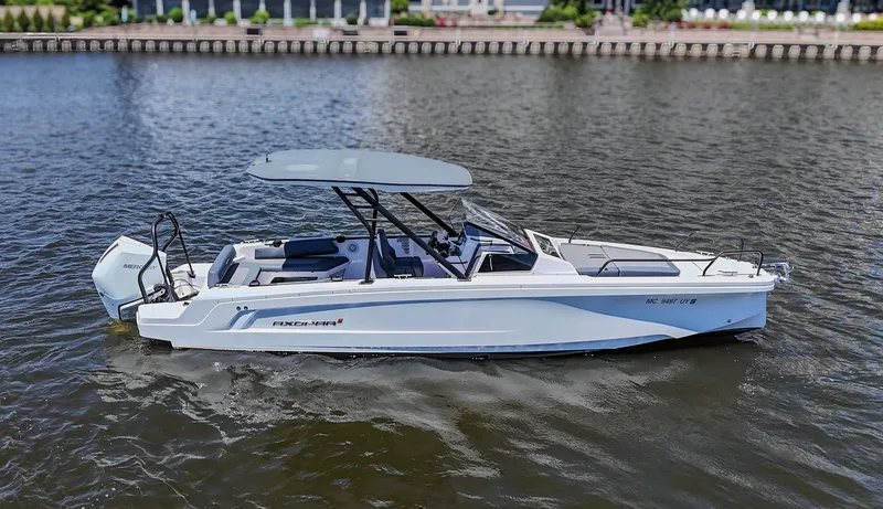 Slide: The Image of A modern motorboat with a canopy on calm water. - 5