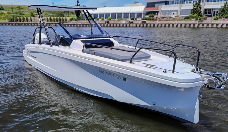 Slide: The Image of A modern motorboat on a river, featuring white seating and a protective canopy. - 6
