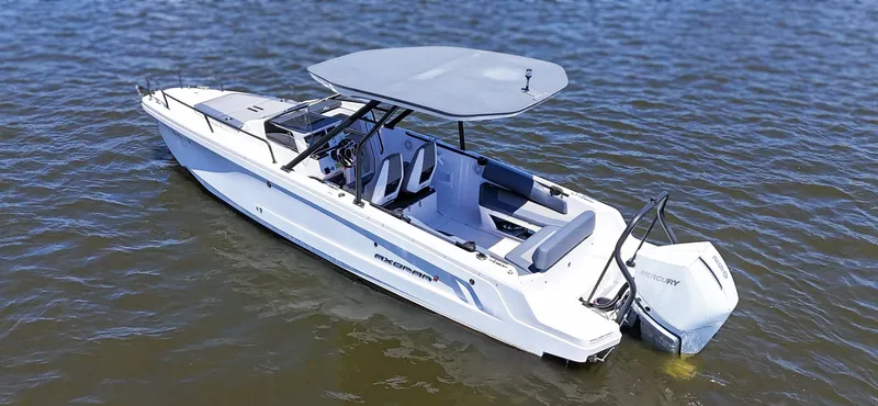 Slide: The Image of A modern motorboat with a gray canopy on calm water. - 8