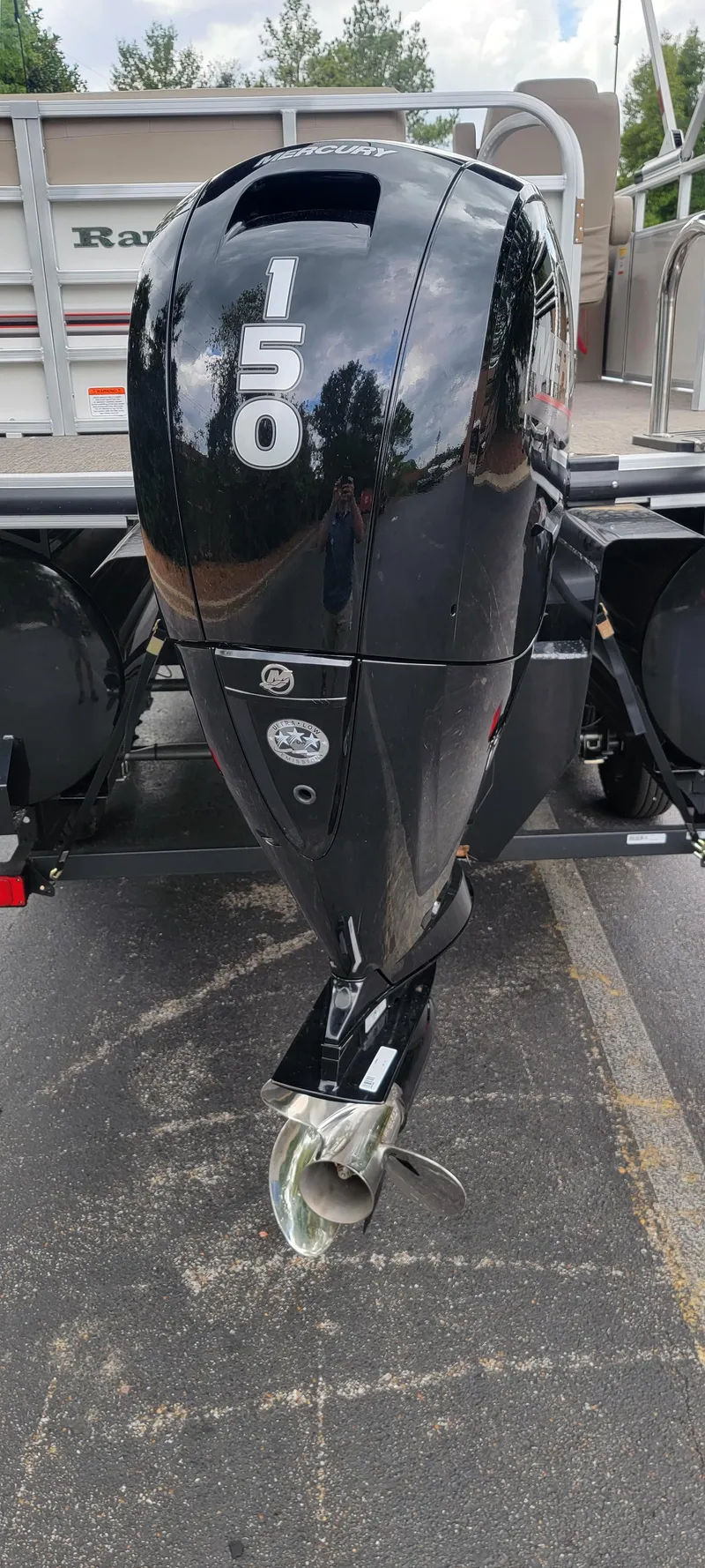 Slide: The Image of A black outboard motor labeled "150" is attached to a boat. - 11