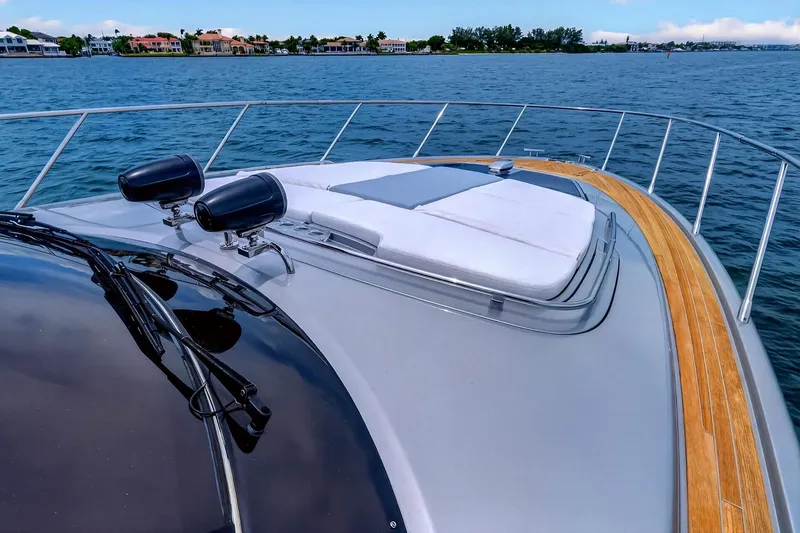 Slide: The Image of Luxury 2022 Riva 56' Rivale yacht with sleek deck design on tranquil water. - 15