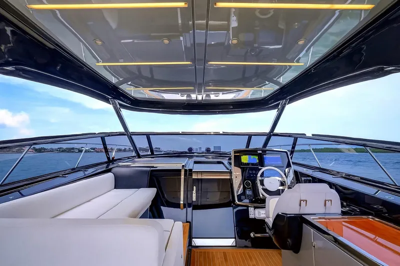 Slide: The Image of Luxurious interior of 2022 Riva 56' Rivale yacht with modern helm and seating. - 24