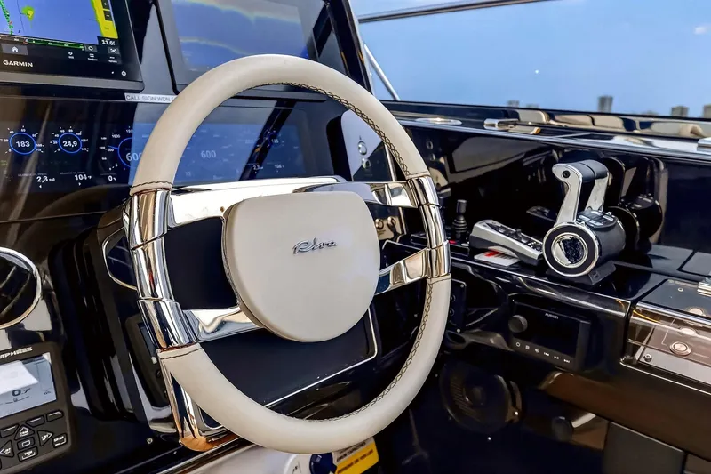 Slide: The Image of Luxurious helm of 2022 Riva 56' Rivale yacht with advanced navigation controls. - 34