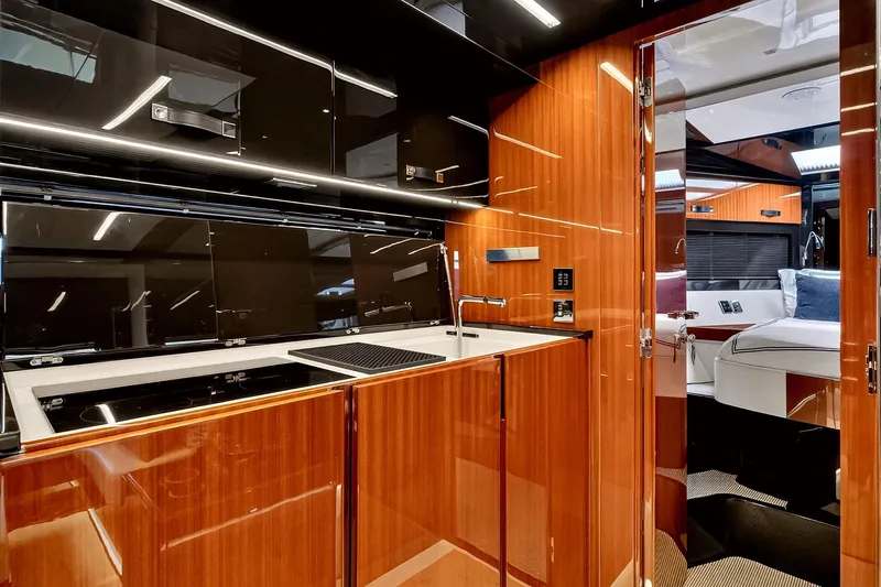 Slide: The Image of Luxurious interior of 2022 Riva 56' Rivale yacht with sleek wood finishes and modern amenities. - 38