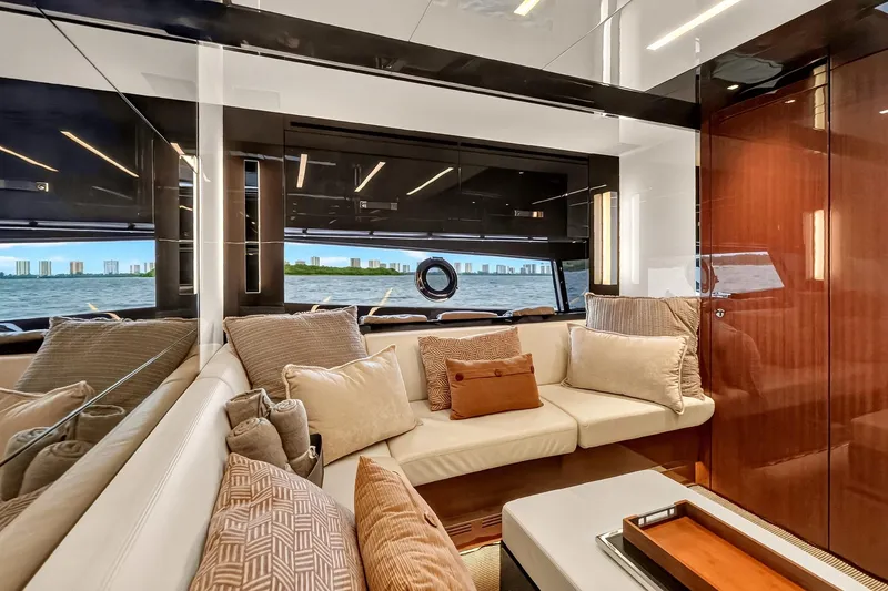 Slide: The Image of Luxurious interior of 2022 Riva 56' Rivale yacht with plush seating and scenic window view. - 42