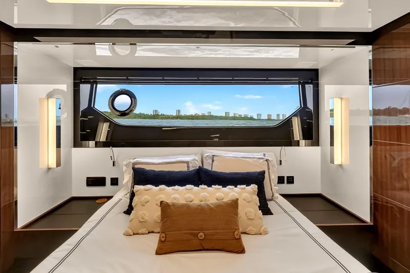 Slide: The Image of Luxurious bedroom interior of 2022 Riva 56' Rivale yacht with scenic window view. - 44