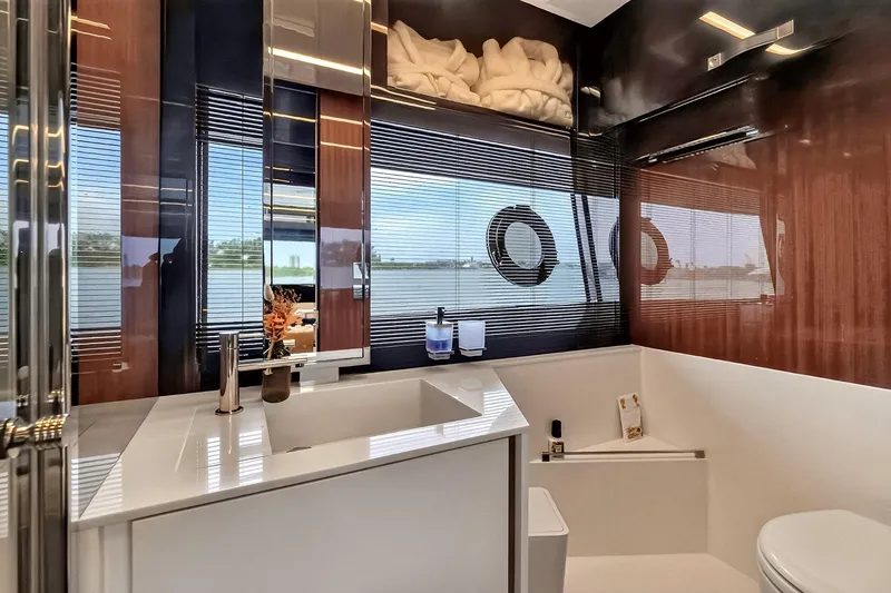 Slide: The Image of Luxurious bathroom interior of 2022 Riva 56' Rivale yacht with modern fixtures and scenic window view. - 45