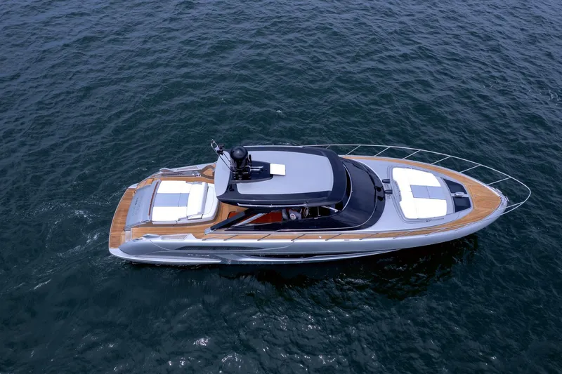 Slide: The Image of 2022 Riva 56' Rivale yacht cruising on open water, showcasing sleek design and luxury features. - 5