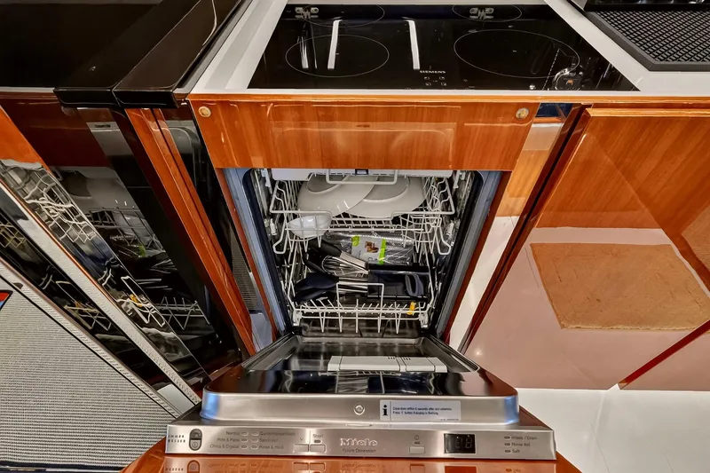 Slide: The Image of Modern kitchen with open dishwasher on a 2022 Riva 56' Rivale yacht. - 51
