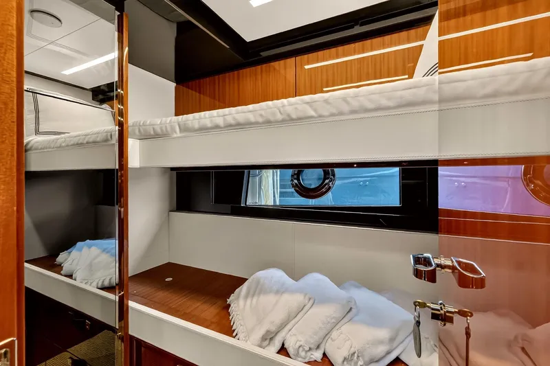 Slide: The Image of Luxurious cabin interior of 2022 Riva 56' Rivale yacht with bunk beds and porthole. - 54
