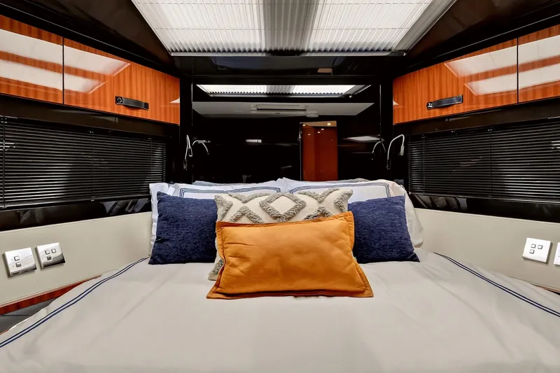 Slide: The Image of Luxurious cabin interior of 2022 Riva 56' Rivale yacht with plush bedding and modern design. - 57