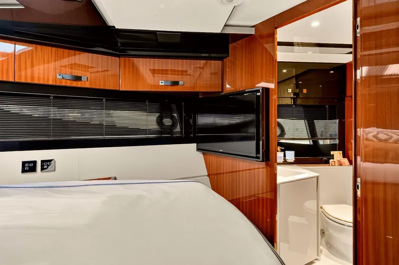 Slide: The Image of Luxurious interior of 2022 Riva 56' Rivale yacht with sleek wood finishes and modern amenities. - 58