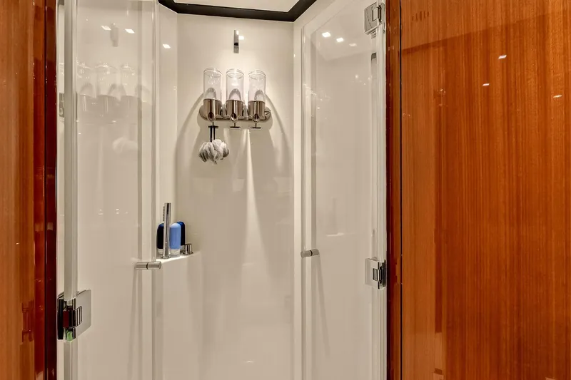 Slide: The Image of Luxurious shower area in 2022 Riva 56' Rivale yacht with sleek wood paneling. - 60