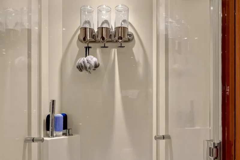 Slide: The Image of Luxury shower area in 2022 Riva 56' Rivale yacht with dispensers and toiletries. - 61