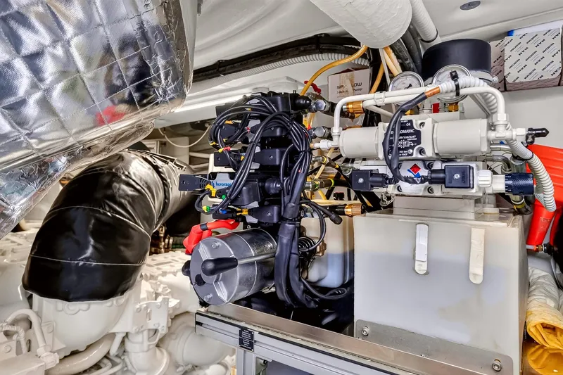 Slide: The Image of Engine room of 2022 Riva 56' Rivale yacht, showcasing advanced mechanical components. - 68