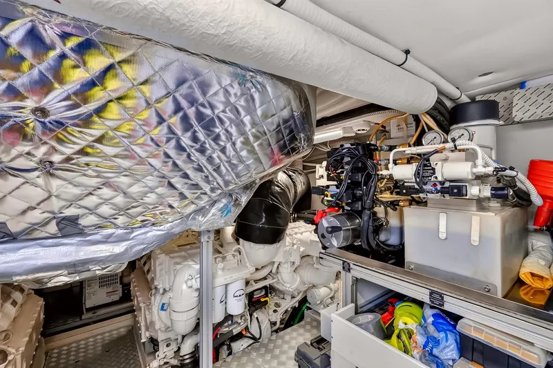 Slide: The Image of Engine room of 2022 Riva 56' Rivale yacht, showcasing advanced mechanical systems and components. - 70